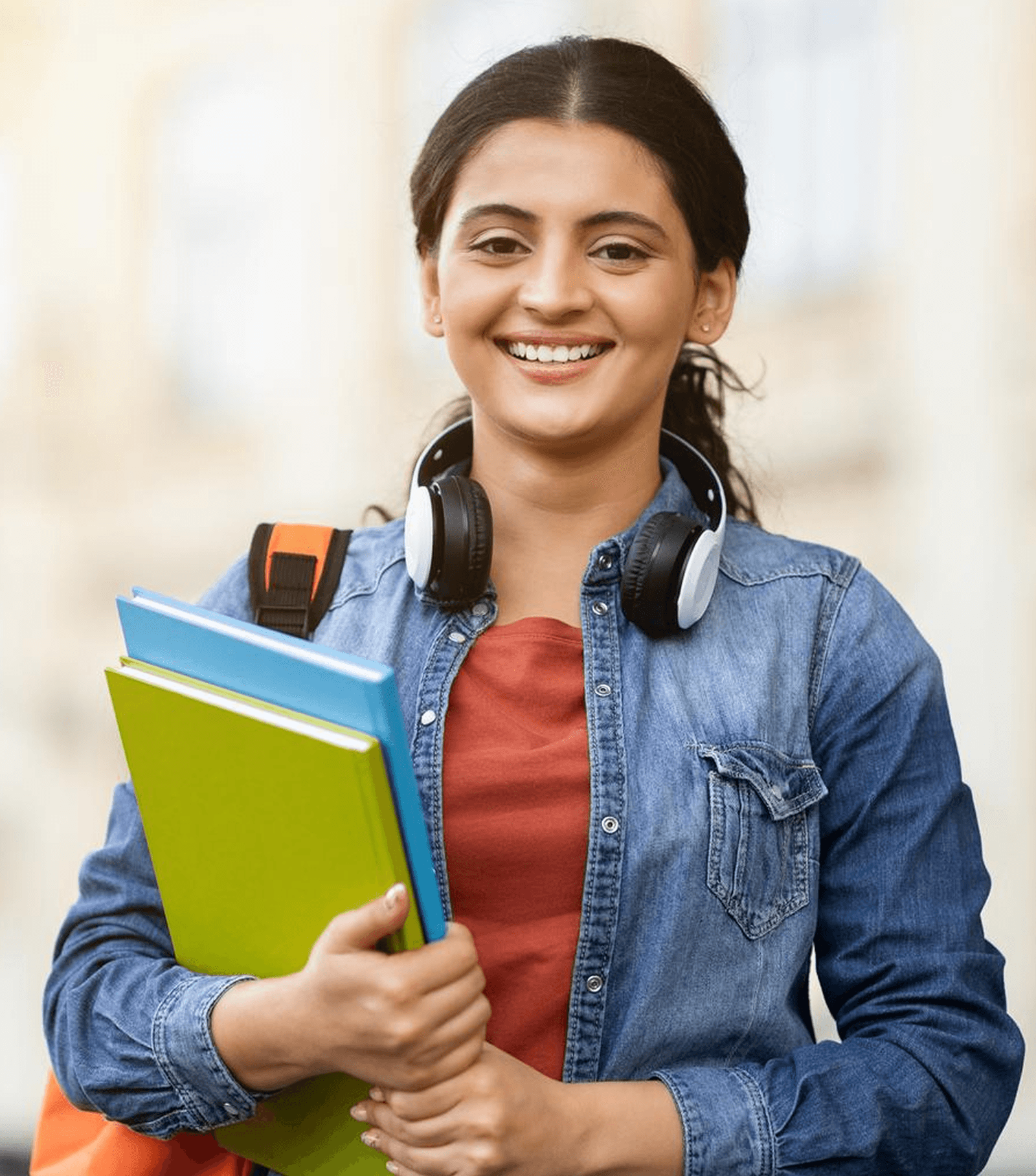 A student on the XLRI Amaravati campus holding her books